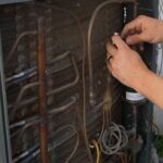 ProSkill technician performing an AC tune-up in Phoenix