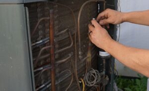 ProSkill technician performing an AC tune-up in Phoenix